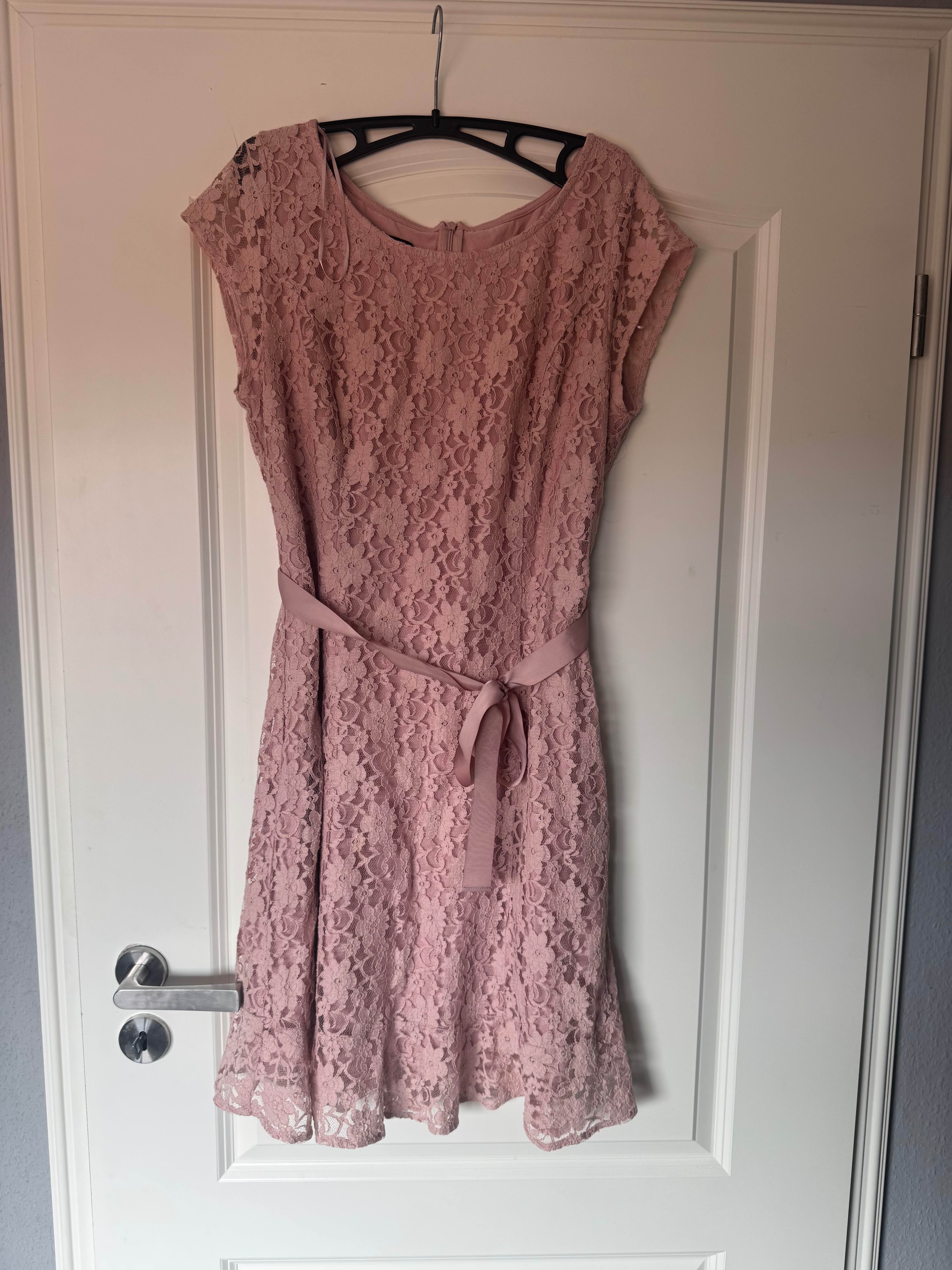Original phone photo of a dress, taken on a hanger